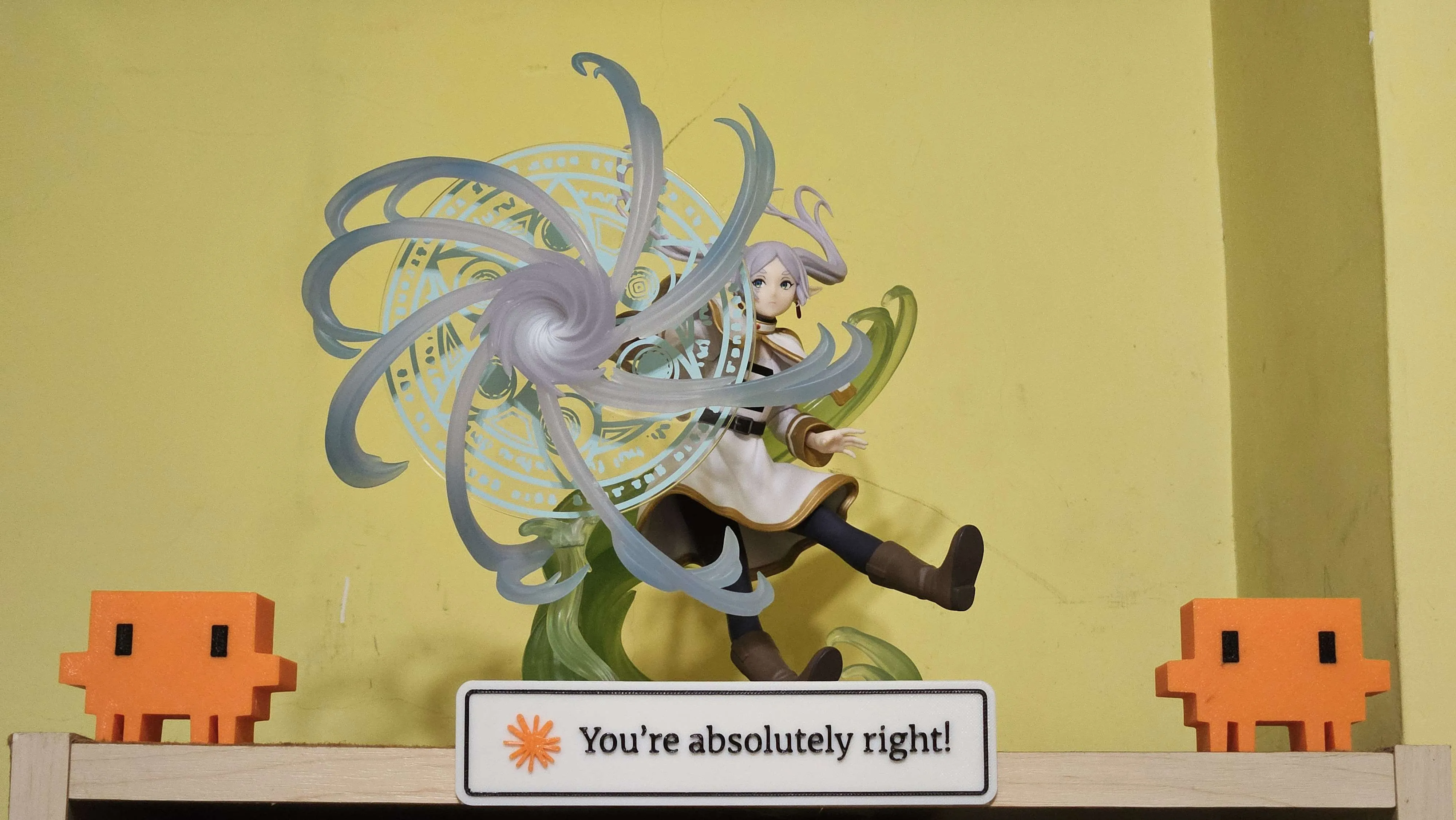 Frieren casting, flanked by two Claude Code avatars — You're absolutely right!